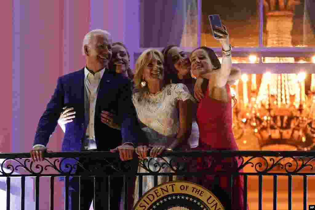 President Joe Biden poses for a photo with granddaughter Finnegan Biden, from left, first lady Jill Biden, granddaughter Naomi Biden and daughter Ashley Biden as they view fireworks during an Independence Day celebration on the South Lawn of the White House, Washington.