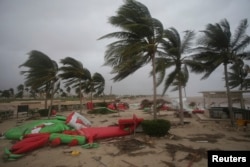 Debris litter a beach after Cyclone Mekunu in Salalah, Oman, May 26, 2018. Cyclone Mekunu blew into the Arabian Peninsula early Saturday, drenching arid Oman and Yemen with rain, downing power lines, officials said.