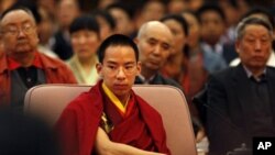 The Chinese-appointed Panchen Lama, Gyaltsen Norbu, the boy chosen by China as the reincarnation of the 10th Panchen Lama, attends a ceremony marking the newly created "Serf Liberation Day" in Beijing, China, Friday, March 27, 2009.