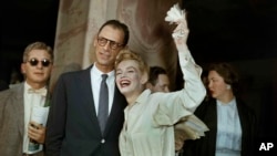 Newlyweds Marilyn Monroe, right, and Arthur Miller are shown after their civil wedding ceremony in White Plains, N.Y., June 29, 1956.