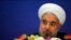 Iran's President Hassan Rouhani arrives to attend a news conference at a hotel after the fourth Conference on Interaction and Confidence Building Measures in Asia (CICA) summit, in Shanghai, May 22, 2014.