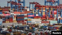 FILE - Shipping containers are seen stacked at Beirut's port, during a countrywide lockdown to prevent the spread of COVID-19, in Beirut, Lebanon, April 8, 2020.