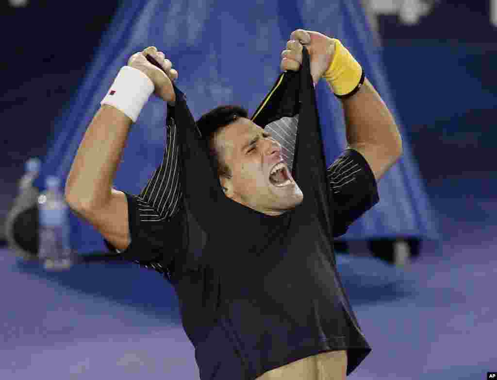 Serbia&#39;s Novak Djokovic celebrates his fourth round win over Switzerland&#39;s Stanislas Wawrinka at the Australian Open tennis championship in Melbourne, Australia.
