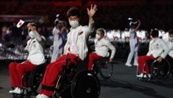 টোকিও ২০২০ প্যারালিম্পিক গেমসের উদ্বোধনী অনুষ্ঠানে জাপানের ক্রীড়াবিদরা। ২৪ আগস্ট ২০২১।