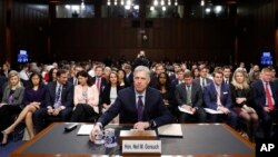 Supreme Court Justice nominee Neil Gorsuch takes his seat as he arrives on Capitol Hill in Washington, March 21, 2017, for his confirmation hearing before the Senate Judiciary Committee.