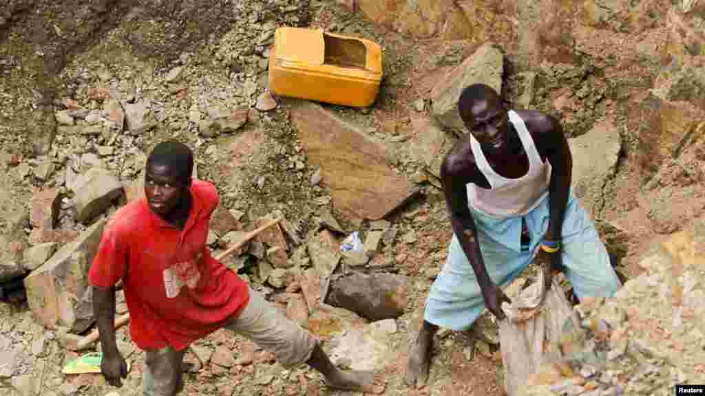 Workers pack rock samples into a bag at a mine in Minna, Niger State.