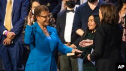 Karen Bass, the first Black woman elected Los Angeles mayor, is sworn in by Vice President Kamala Harris, a longtime friend and former California attorney general in Los Angeles, Dec. 11, 2022.
