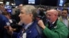 Traders work on the floor of the New York Stock Exchange shortly before the closing bell in New York, Jan. 6, 2017. 