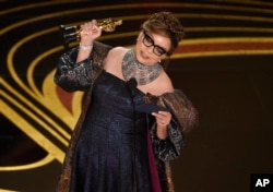 Ruth E. Carter accepts the award for best costume design for "Black Panther" at the Oscars on Sunday, Feb. 24, 2019, at the Dolby Theatre in Los Angeles.