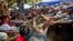 Student protesters struggle with riot police to remove a barricade during a protest against new education law in Letpadan, 140 kilometers (90 miles) north of the country's main city Yangon, Myanmar, March 10, 2015. Police arrested Kyaw Ko Ko, the leader of the student movement after he spent more than six months in hiding, a human rights monitoring group said.