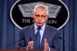FILE - Then-Defense Secretary Chuck Hagel speaks during a news conference at the Pentagon, Nov. 14, 2014.
