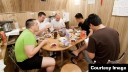 The Mars500 crew is shown having breakfast together inside one of the facility’s modules. (European Space Agency/Institute for Biomedical Problems)