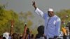 Gambia's new president Adama Barrow waves to supporters as he leaves the airport in Banjul, Jan. 26, 2017, after returning from Senegal.