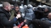 Serbian police scuffle with opposition protesters demanding arrests in connection with a deadly roof collapse at a railway station in Novi Sad, Serbia, Nov. 21, 2024.