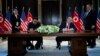 President Donald Trump and North Korean leader Kim Jong Un participate in a signing ceremony during a meeting on Sentosa Island, June 12, 2018, in Singapore. 