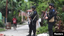 Police Mobile Brigade (Brimob) officers stand guard near Nayak Abepura student dormitory in Jayapura, Papua, Sept. 1, 2019 in this photo taken by Antara Foto.