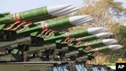 Myanmar's military trucks loaded with missiles are seen during a ceremony marking Myanmar's 75th anniversary of Independence Day in Naypyitaw, Myanmar, Wednesday, Jan. 4, 2023.