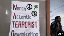 Плакат организаторов «контрсаммита НАТО»: Северо-атлантическая Террористическая Организация