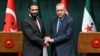 Syria's interim President Ahmed al-Sharaa, left, and Turkish President Recep Tayyip Erdogan shake hands during a press conference after their meeting at the Presidential Palace in Ankara, Turkey, Feb. 4, 2025.