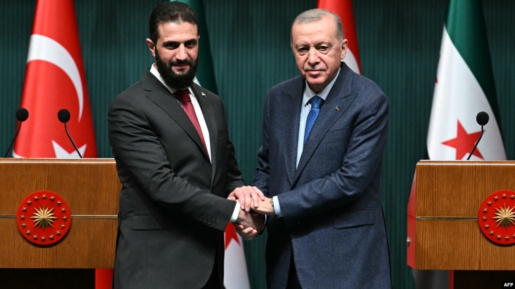 Syria's interim President Ahmed al-Sharaa, left, and Turkish President Recep Tayyip Erdogan shake hands during a press conference after their meeting at the Presidential Palace in Ankara, Turkey, Feb. 4, 2025.