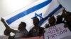 Asylum-seekers march during a protest outside Israeli Prison Saharonim, in Negev desert, southern Israel, Feb. 22, 2018. 