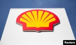 FILE - A logo for Shell is seen on a garage forecourt in central London, Britain, March 6, 2014.