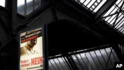 A campaign poster at a train station in Zurich reads 'Ivan S, rapist and soon to be Swiss?', 28 Nov 2010