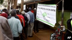 FILE - Kenyan voters line up to cast their votes in the Kibera slum, Nairobi, Kenya.