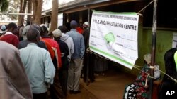 FILE - Kenyan voters line up to cast their votes in the Kibera slum, Nairobi, Kenya, March 4, 2013.