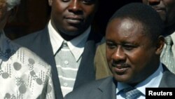 FILE - Former South African President Nelson Mandela, center, poses with President Domitien Ndayizeye, left, and Jean Minani, speaker of Burundi parliament, July 21, 2004.