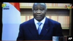 A picture of a TV screen shows Ivory Coast strongman Laurent Gbagbo delivering a speech in which he insists he remains the country's true president, 21 Dec 2010