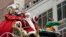 Santa Claus waves from atop a float while riding along 6th Ave. during the Macy's Thanksgiving Day Parade, Nov. 25, 2021, in New York.