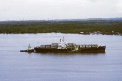 The arrival of the container ship SS Mayaguez after leaving Cambodia for Singapore, May 1975. (AP Photo)