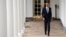 U.S. President Barack Obama walks down the colonnade from the Oval Office at The White House in Washington, Jan. 12, 2016. 
