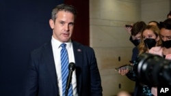 FILE - Congressman Adam Kinzinger, a Republican from Illinois, speaks to reporters at the Capitol in Washington, May 12, 2021. 