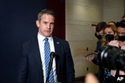 FILE - Congressman Adam Kinzinger, a Republican from Illinois, speaks to reporters at the Capitol in Washington, May 12, 2021.