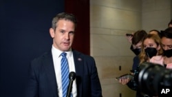 FILE - Congressman Adam Kinzinger, a Republican from Illinois, speaks to reporters at the Capitol in Washington, May 12, 2021.
