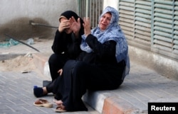 Relatives of Palestinian Othman Helles, 15, who was killed at the Israel-Gaza border, react in Gaza City, July 13, 2018.