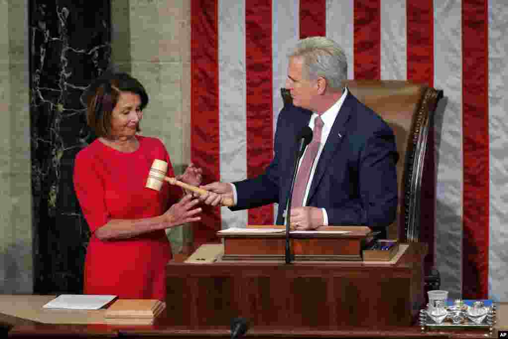 House speaker Nancy Pelosi of California, who will lead the 116th Congress as Speaker of the House is handed the gavel by Rep. Kevin McCarthy, R-Calif., at the U.S. Capitol in Washington, Jan. 3, 2019.