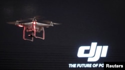 FILE - The DJI Phantom 3, a consumer drone, takes flight after it was unveiled at a launch event in Manhattan, New York, April 8, 2015.