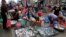 Ethnic Vietnamese sell fish on the sidewalk of Prek Pnoa's morning fish market on the outskirt of Phnom Penh, file photo. 
