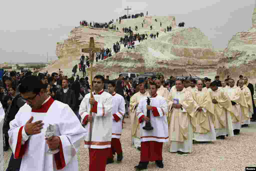 Pilgrims make their way to attend mass at the baptism site in Bethany, Jordan. Thousands of Catholics flocked to the site on the banks of the Jordan River to kick start the pilgrimage. 