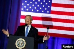 FILE - U.S. President Donald Trump delivers remarks at the state fairgrounds in Indianapolis, Indiana, Sept. 27, 2017.