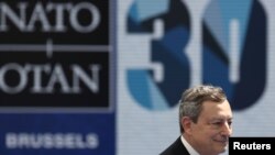 Italian Prime Minister Mario Draghi arrives for the NATO summit at the Alliance's headquarters, in Brussels, Belgium, June 14, 2021.