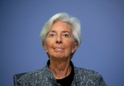 FILE -- In this Thursday, March 12, 2020 file photo the President of European Central Bank Christine Lagarde looks up prior to a press conference following a meeting of the ECB governing council in Frankfurt, Germany.
