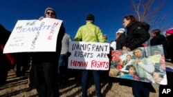 Supporters hold up a placard during a rally in for Jeanette Vizguerra, a Mexican woman seeking to avoid deportation from the United States, outside the Immigration and Customs Enforcement office in Centennial, Colo. 