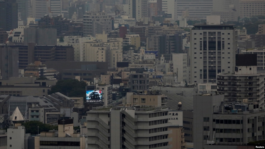 Papan iklan mobil terlihat di pusat kota Tokyo, di Jepang, 7 Juni 2016. (Foto:dok)
