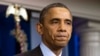 President Barack Obama pauses as he speaks about the death of Nelson Mandela in the briefing room of the White House, Dec. 5, 2013.