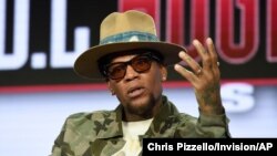 FILE - D.L. Hughley speaks during TV One's "Uncensored" and "The D.L. Hughley Show" panel during the Winter Television Critics Association Press Tour in Pasadena, California, Feb. 13, 2019.
