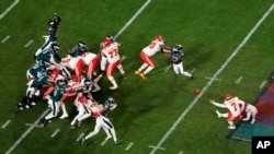 FILE - Kansas City Chiefs place kicker Harrison Butker (7) kicks the game-winning field goal in the second half of the NFL Super Bowl 57 football game, against the Philadelphia Eagles Sunday, Feb. 12, 2023, in Glendale, Ariz. (AP Photo/David J. Phillip, File)